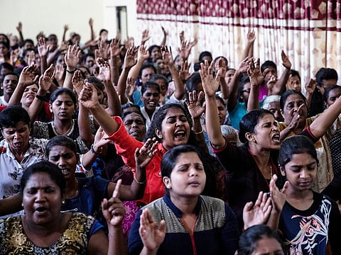 Members of Zion Church, which was bombed on Easter Sunday, pray at a community hall in Batticaloa, Sri Lanka, May 5, 2019.