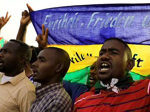 Protesters shout slogans during a demonstration in front of the defence ministry compound in Khartoum on Saturday.