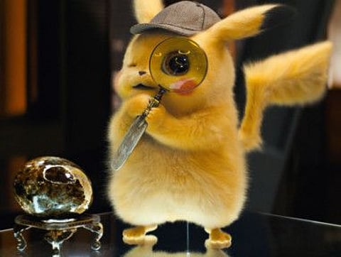 This image released by Warner Bros. Pictures shows the character Detective Pikachu, voiced by Ryan Reynolds, in a scene from "Pokemon Detective Pikachu." (Warner Bros. Pictures via AP)
