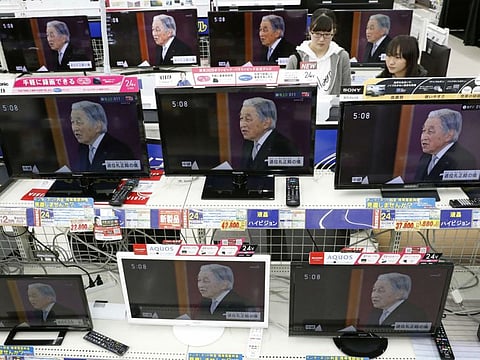 TV screens show news program reporting on Emperor Akihito's abdication, at an electrical appliance store in Urayasu, near Tokyo Tuesday, April 30, 2019.