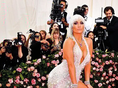 Jennifer Lopez turned up the drama with a slinky Versace dress.