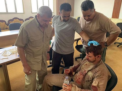 This picture published on the Libyan National Army (LNA) War Information Division's Facebook page on May 7, 2019, shows the reported foreign pilot of a Mirage F1, that was shot down by troops loyal to military strongman Khalifa Haftar, in custody in Al-Hira region, 70 kilometres south of the capital.