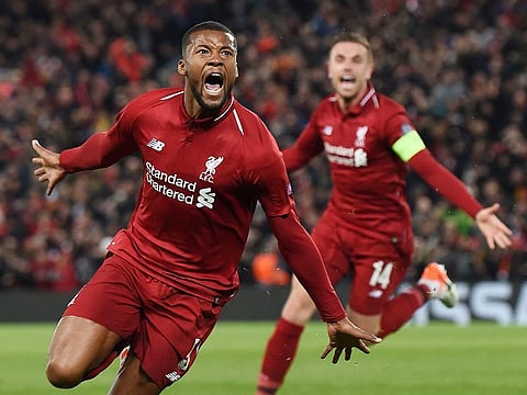 Liverpool's midfielder Georginio Wijnaldum celebrates after scoring their third goal during the UEFA Champions league semi-final second leg football match between Liverpool and Barcelona at Anfield in Liverpool, north west England on May 7, 2019.