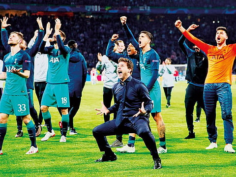 Tottenham manager Mauricio Pochettino, Ben Davies, Fernando Llorente and Erik Lamela celebrate after the match.