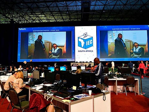 Various political party observers sit inside the Independent Electoral Commission Results Centre in Pretoria after South Africa's national and provincial elections on May 8, 2019.