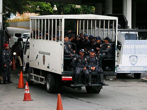 National Police enter the Helicoide prison in Caracas, Venezuela, Thursday, May 9, 2019, where Edgar Zambrano, vice president of the opposition-controlled National Assembly is being held after his arrest the previous night.