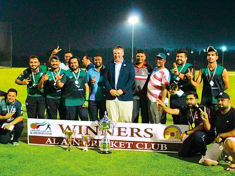 Pulse Secure Wolves team pose with the winners trophy after clinching the Al Ain Cricket Big Bash League.