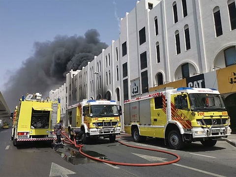 A fire near Abu Bakr Al Siddiqi metro station damaged three vehicles and a warehouse.