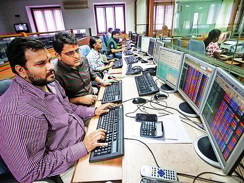 Indian traders work at a brokerage firm in Mumbai. ndian companies have started the year with more debt offerings overseas.
