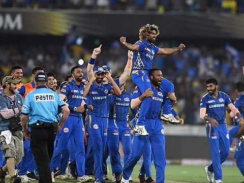Mumbai Indians cricketers celebrate after winning the 2019 Indian Premier League (IPL) against Chennai Super Kings at the Rajiv Gandhi International Cricket Stadium in Hyderabad on May 12, 2019.