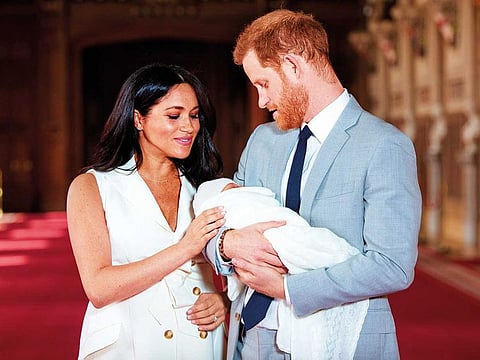 Britain’s Prince Harry and Meghan, Duchess of Sussex are seen with their baby son Archie Harrison Mountbatten-Windsor at Windsor Castle