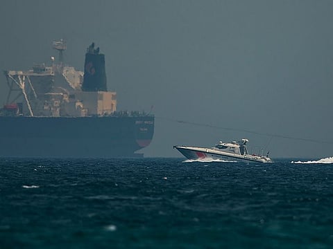 An Emirati coast guard vessel passes an oil tanker off the coast of Fujairah.