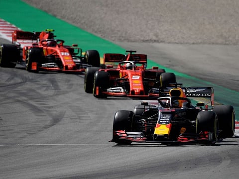 From front-back: Red Bull Racing's Belgian driver Max Verstappen, Ferrari's German driver Sebastian Vettel and Ferrari's Monegasque driver Charles Leclerc compete in the Spanish Formula One Grand Prix at the Circuit de Catalunya in Montmelo in the outskirts of Barcelona on May 12, 2019.