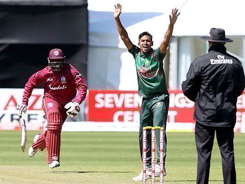 Bangladesh's Mustafizur Rahman appeals successfully for LBW against West Indies' Raymon Reifer.