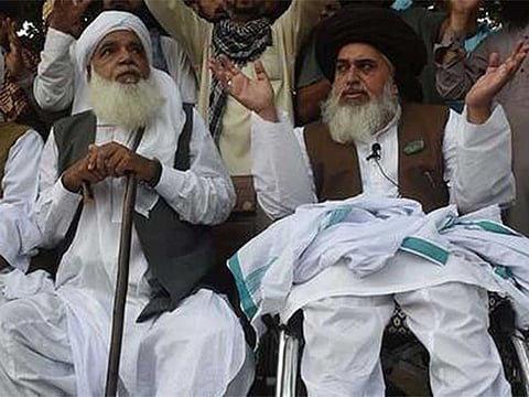 Khadim Hussain Rivzi, Chief of Tehreek-e-Labbaikh Pakistan (TLP) and Pir Afzal Qari, Patron-in-Chief of the TLP during a protest rally against the Supreme Court' verdict to acquit Asia Bibi last year.
