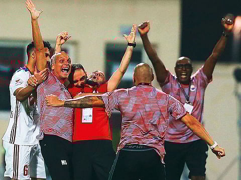 Sharjah team members celebrate their victory at the Arabian Gulf league.