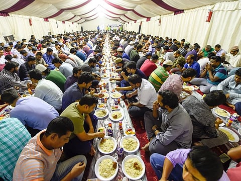 Muslims having iftar at Kerala Muslim Culcural Centre in Deira.