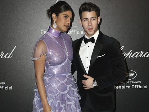 Priyanka Chopra, left, and singer Nick Jonas pose for photographers upon arrival at the Chopard Love event at the 72nd international film festival, Cannes, southern France, Friday, May 17, 2019.