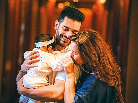 Neha Dhupia and husband Angad Bedi with their daughter Mehr.