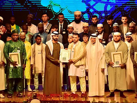 Shaikh Mansour Bin Mohammad Bin Rashid Al Maktoum presents the top prize to Muaz Mohammad from Libya at the 23rd edition of the Dubai International Holy Quran Award on 19th May, 2019.