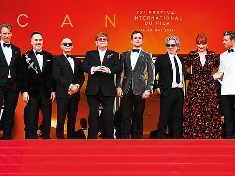 Record producer Giles Martin, filmmaker David Furnish, songwriter Bernie Taupin, singer-songwriter Elton John, actor Taron Egerton, director Dexter Fletcher, actress Bryce Dallas Howard and actor Richard Madden pose as they arrive for the screening of the film ‘Rocketman’.