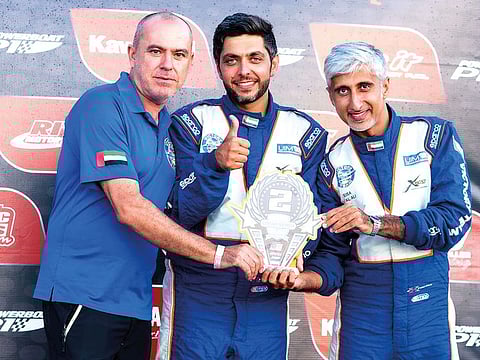 Salem Al Adidi (centre) and Eisa Al Ali (extreme right) celebrate their trophy with chief engineer Luciano Barbati at the end of the first round of the 2019 ABPA Offshore Championship Series held on Cocoa Beach, Florida, late on Sunday.