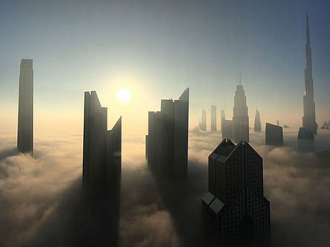 Dubai skyline enveloped by fog.