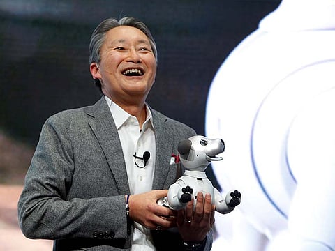 Kazuo Hirai, president and CEO of Sony Corporation, holds an Aibo robotic dog during a news conference at the 2018 CES in Las Vegas, Nevada on January 8, 2018.
