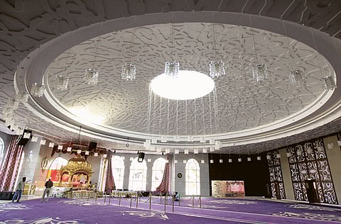 The four-level gurudwara in Jebel Ali sprawls a massive 100,000 square feet with a prayer hall, above, that can accommodate up to 3,000 people