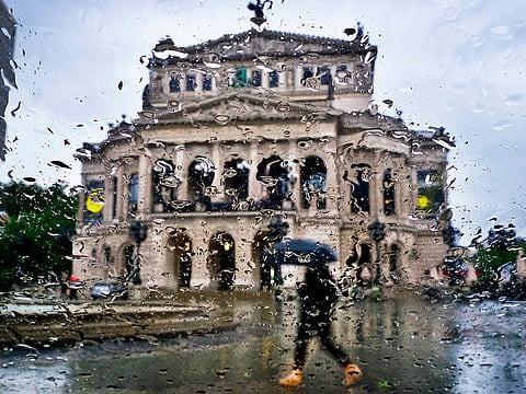 The Old Opera is seen through rain drops on a car window in Frankfurt, Germany, Tuesday, May 21, 2019.