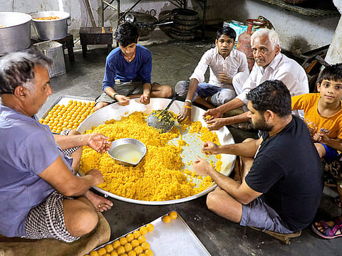 Laddoos (a popular sweet during celebrations) being prepared at a sweet-shop