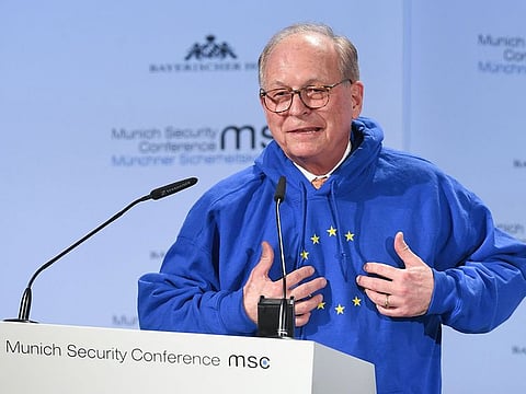 In this file photo taken on February 15, 2019 Wolfgang Ischinger, chairman of the Munich Security Conference (MSC), wears a hoodie with the European flag with one missing star while giving a speech to open the 55th Munich Security Conference in Munich, southern Germany.