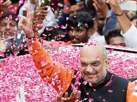 BJP President Amit Shah arrives at the party headquarters after learning the initial election results, in New Delhi, on May 23, 2019.