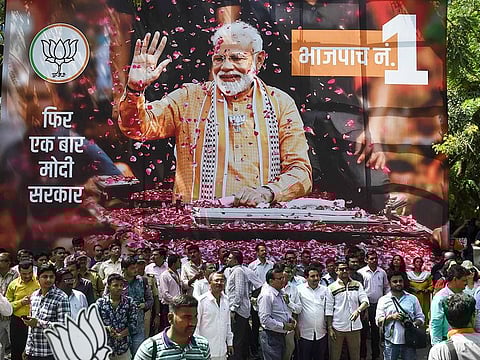 BJP supporters gather to celebrate on the election results outside the party headquarters in Mumbai.