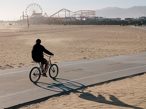 A man rides a bike along the beach in Santa Monica, California. A promising new study links exercise, memory and ageing