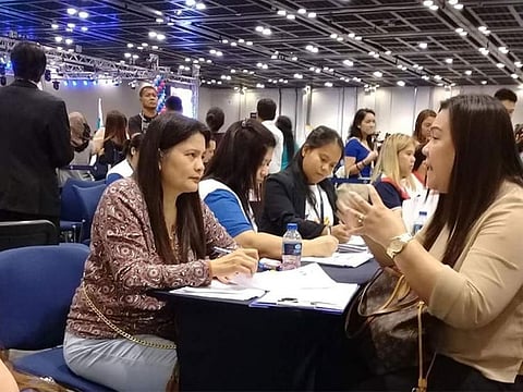 Participants at a job fair in Dubai