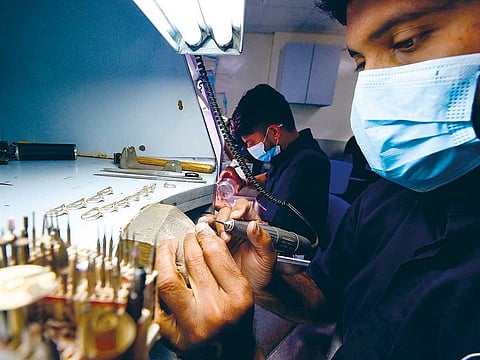Craftsmen design jewellery at Al Barakah Gold Factory, a unit of Malabar Gold, in Sharjah. What jewellers have been doing over the last year is make more of the diamond-studded jewellery here rather than rely on imports alone