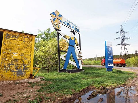 A Soviet-era sign for the Druzhba oil pipeline near the village of Nikolayevka. Russian oil officials talk about 20 million barrels that are contaminated.