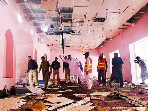 Police officers and rescue workers gather at the site after a blast in a mosque in Quetta. Two people were said to have been killed and 28 injured in the blast.