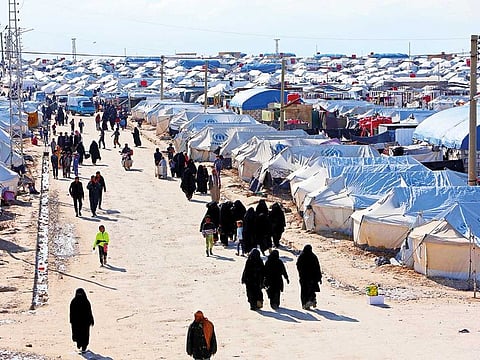 Women walk through Al Hol displacement camp in Hasaka governorate, Syria.