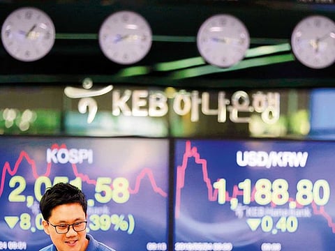 A trader at a foreign exchange dealing room in Seoul. The MSCI Asia Pacific Index is headed for a third straight week of declines — the longest stretch this year.