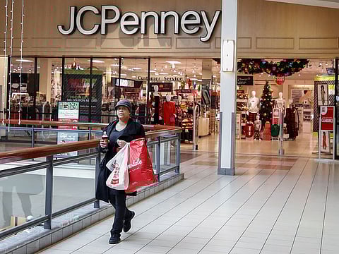 A shopper leaves the J.C. Penney department store in North Riverside, Illinois. The company filed for bankruptcy, punctuating decades of decline and failed turnaround plans.
