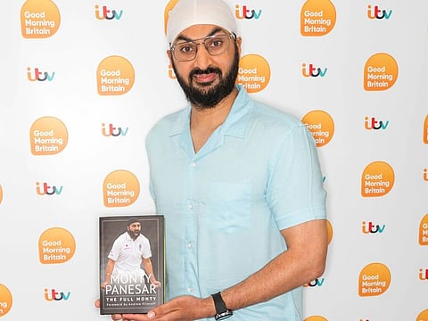 Former England spinner Monty Panesar with his book.