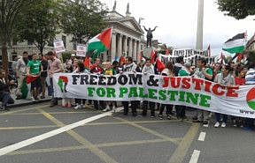 People come together to support Palestine as they walk towards the Israeli embassy in Dublin, Ireland