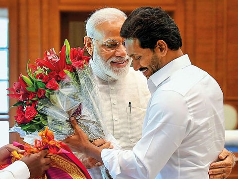 Prime Minister Narendra Modi is greated by YSR Congress Party President and Andhra Pradesh Chief Minister-designate YS Jagan Mohan Reddy, at his residence  in New Delhi.