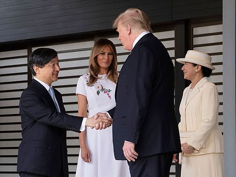 US President Donald Trump, second right, and first lady Melania Trump, second left, are bid farewell by Japan's Emperor Naruhito and Empress Masako as they leave the Imperial Palace in Tokyo Monday, May 27, 2019.
