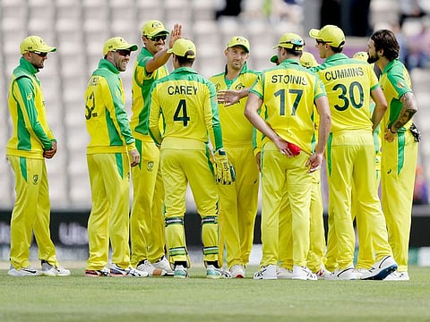 Australia's Kane Richardson, right, celebrates taking the wicket of Sri Lanka's captain Dimuth Karunaratne during the Cricket World Cup warm-up match between them at the Hampshire Bowl in Southampton, England, Monday, May 27, 2019.