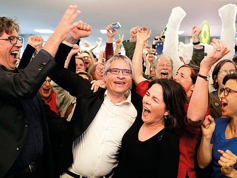 Green party chairwoman Annalena Baerbock and EU parliament member Sven Giegold celebrate after first results in Berlin, Germany, on Sunday.
