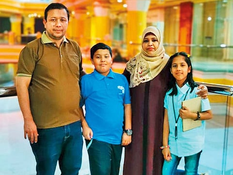 Khuzaima and his twin sister Komal with their father Shafi Ullah Khan Niazi and mother Arifa.