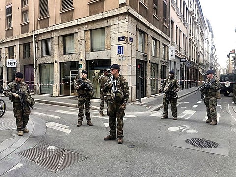 Soldiers of French antiterrorist plan "Vigipirate Mission", secure the access near the site of a suspected bomb attack in central Lyon, Friday May, 24, 2019.